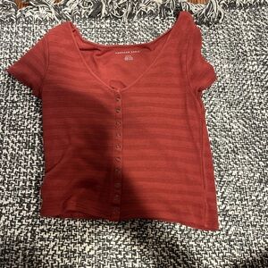 red/pink short sleeve american eagle tee with button up detail